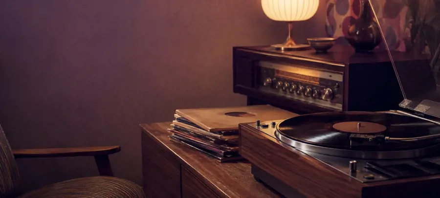 Vintage record player with vinyl records for classic music trivia